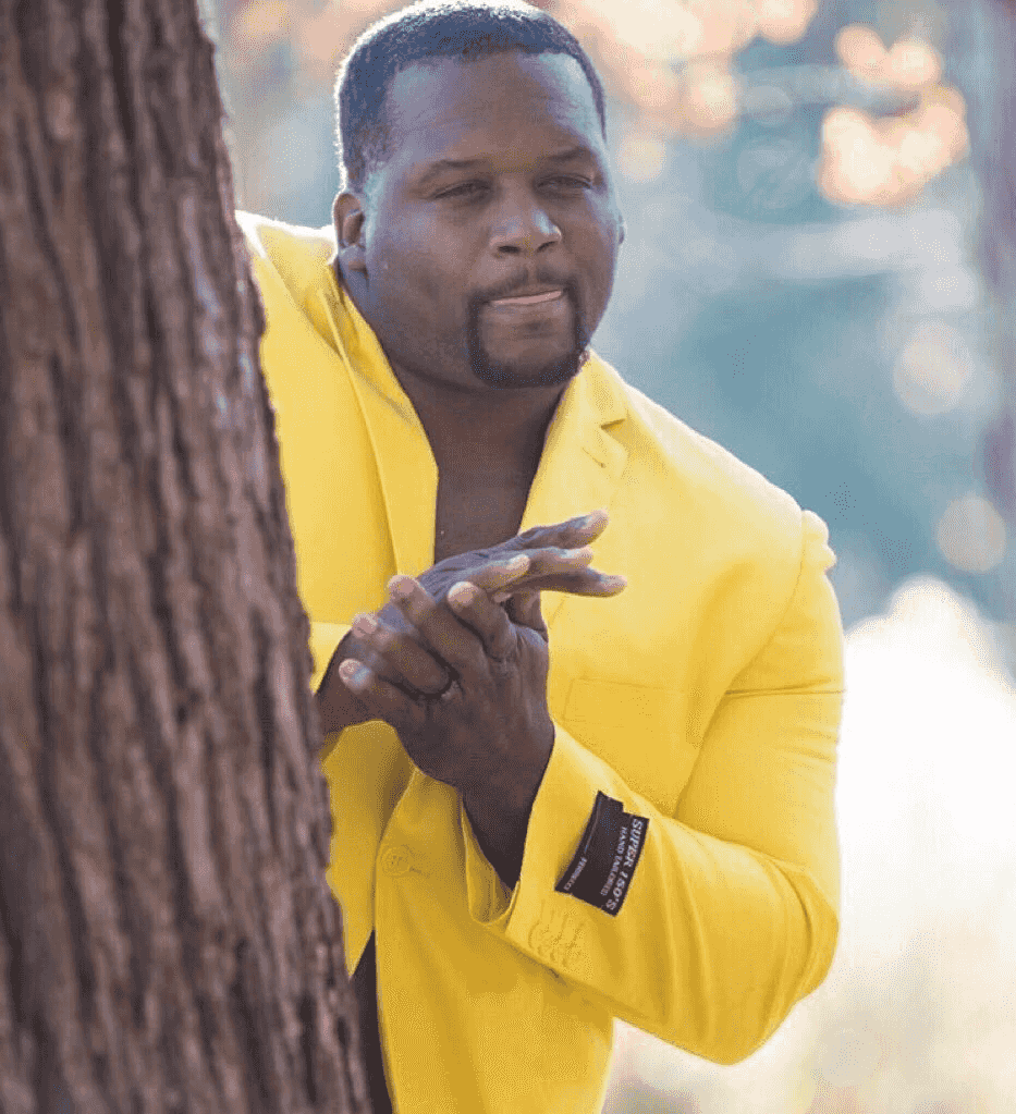 black-guy-hiding-behind-tree